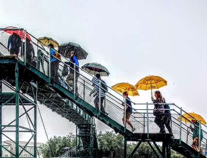Alany exiting the golf course at Portrush when an Northern Irish 'wee shower' hits. 
